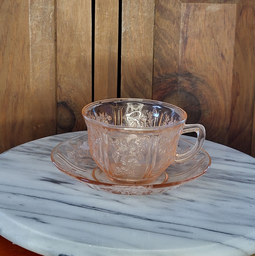 Elegant Pink Glass Teacup and Saucer Set